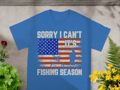 Blue t-shirt with American flag graphic: "Sorry I Can't, It's Fishing Season."