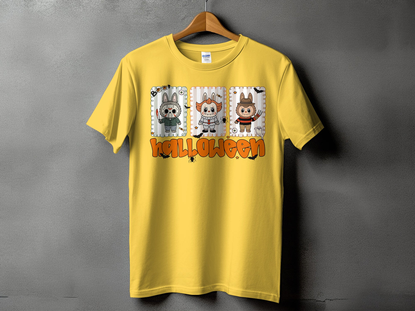 Yellow t-shirt with three cartoon horror characters and the word Halloween.