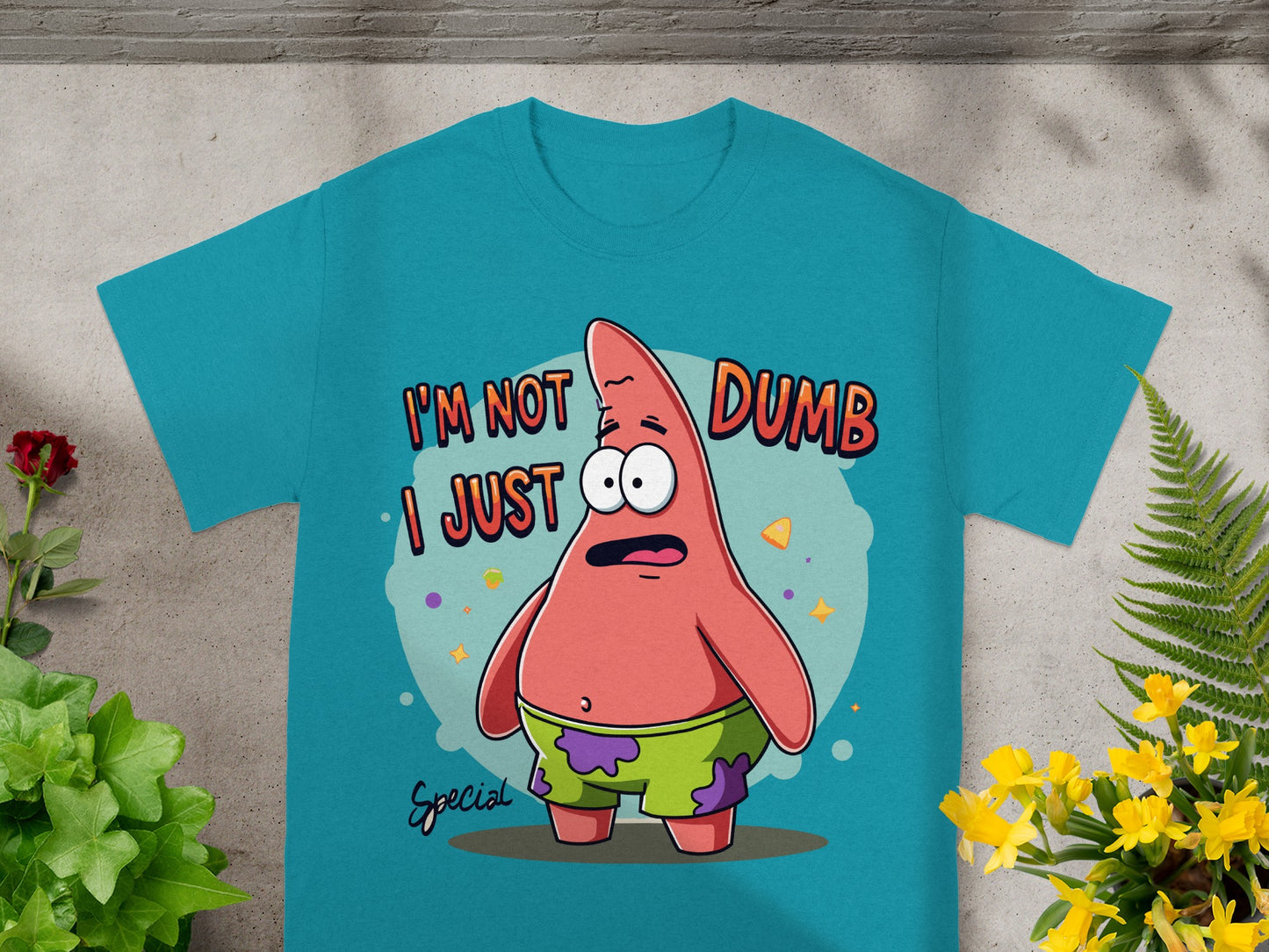 Teal t-shirt with Patrick Star saying "I'm not dumb, I just special."
