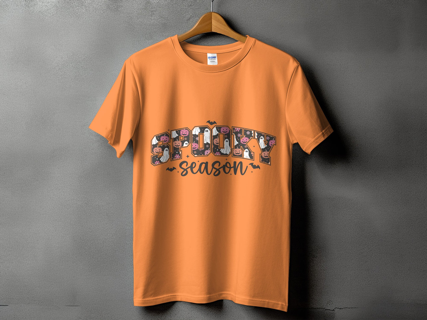 Orange t-shirt with "Spooky Season" text and Halloween graphics.
