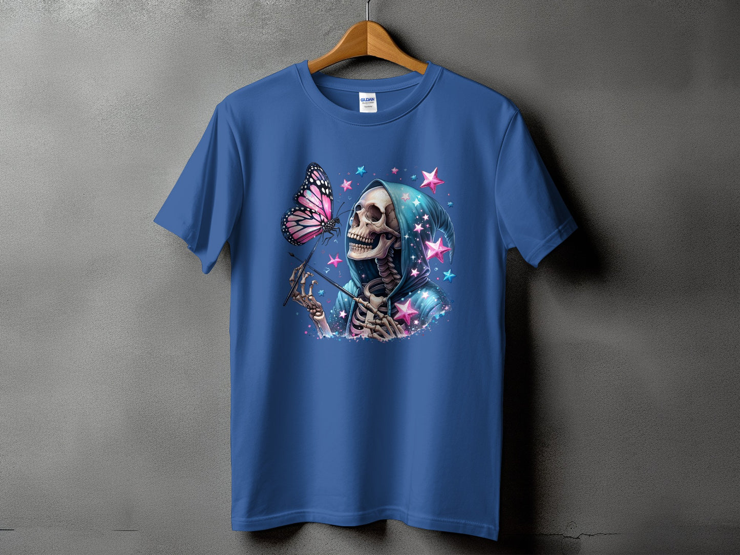 Skeleton in a blue hoodie with a butterfly and pink stars on a blue t-shirt.