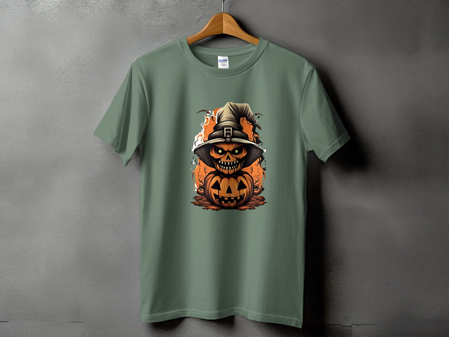 Green t-shirt with a stacked jack-o'-lantern design wearing a witch hat.