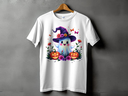 White t-shirt with cartoon ghost in witch hat, pumpkins, and flowers.