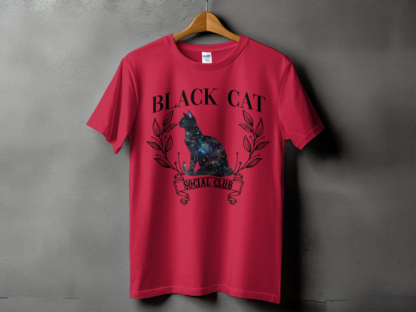Red t-shirt with galaxy-filled black cat graphic and text "BLACK CAT SOCIAL CLUB."