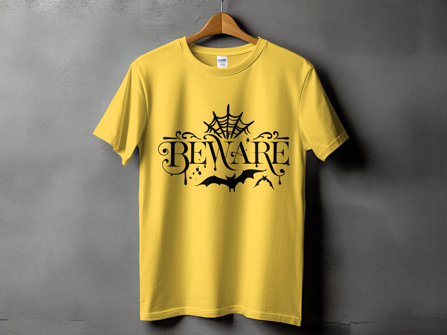 Yellow t-shirt with black "BEWARE" text, spiderweb, and bats graphic.