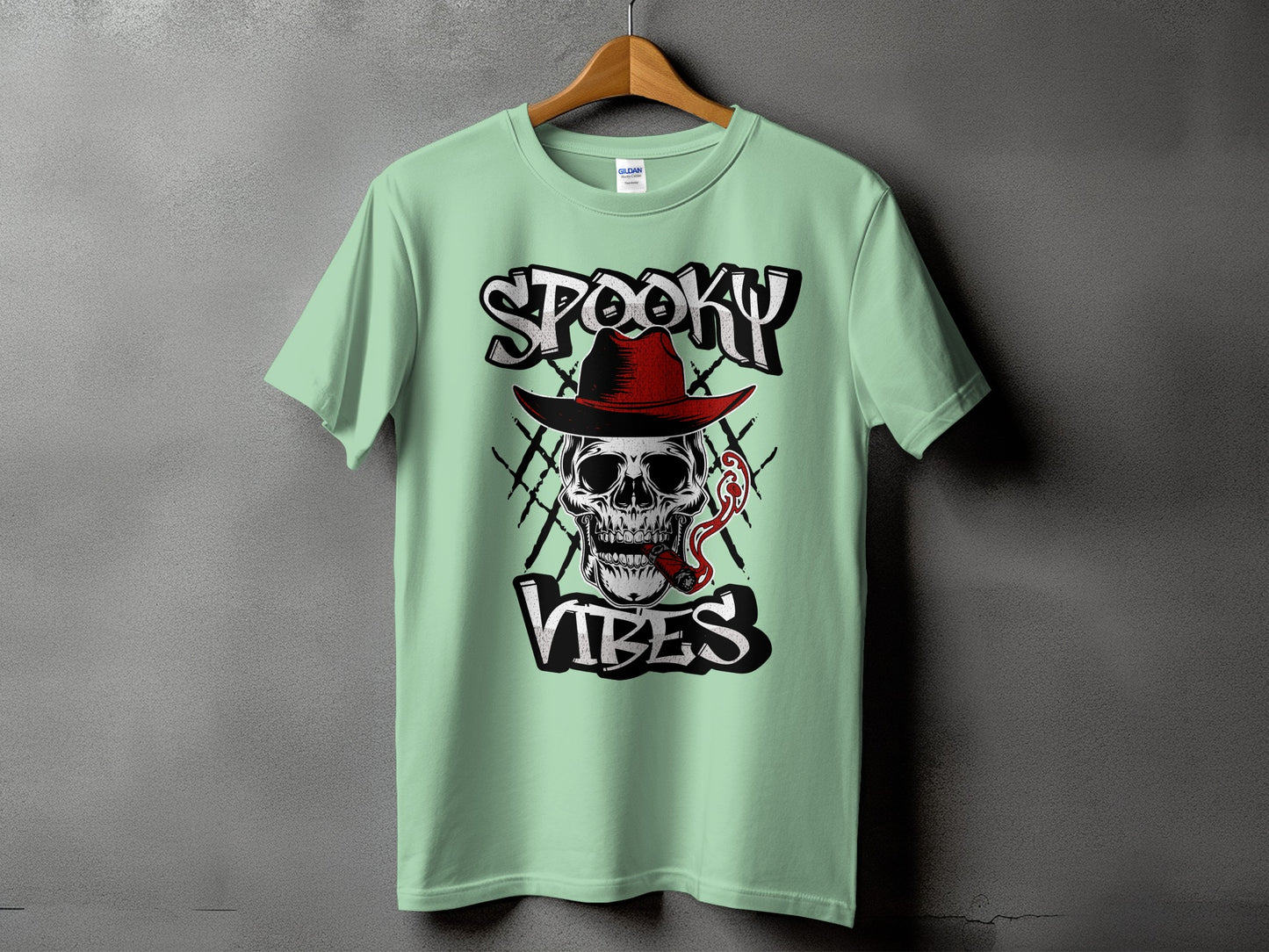 Light green t-shirt with skull, cigar, and text "Spooky Vibes".