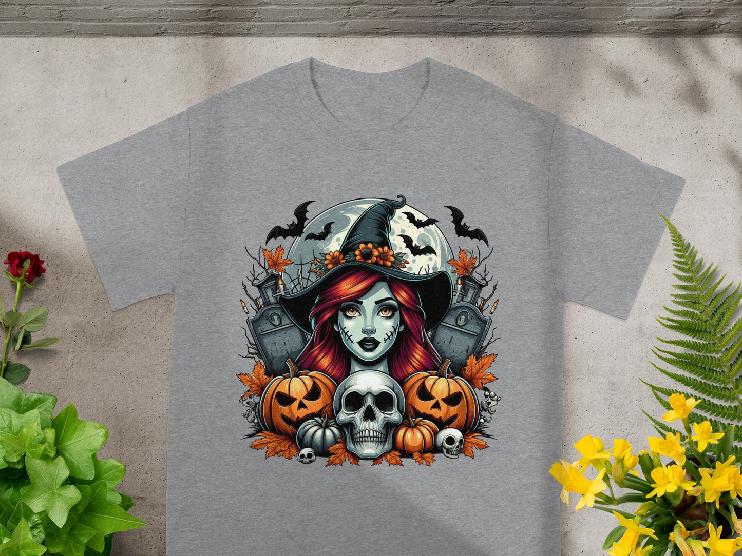 Halloween t-shirt with witch, pumpkins, skull, tombstones, bats, and moon.