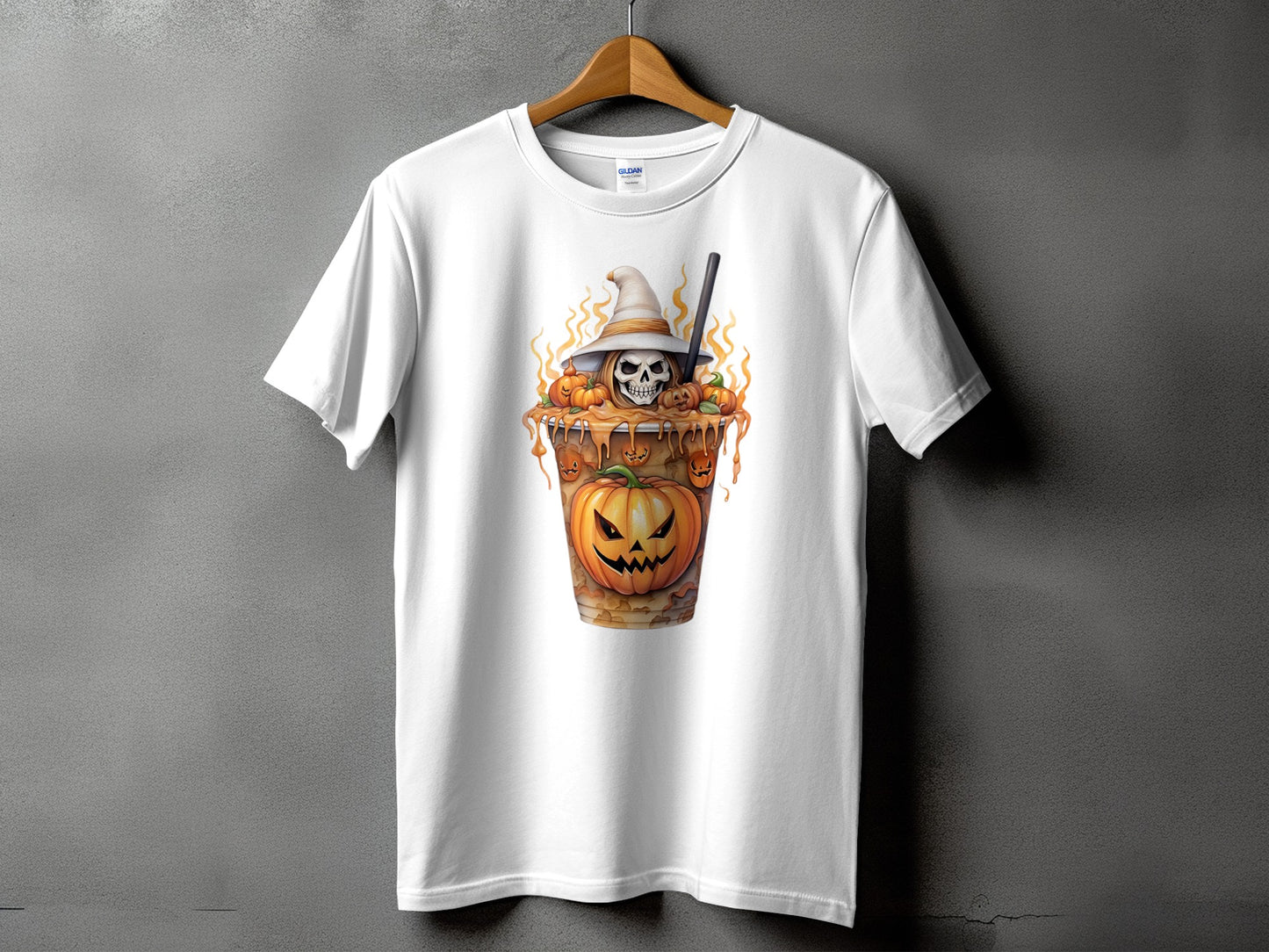 White t-shirt with a Halloween design of a skull in a witch hat, pumpkins, and caramel.