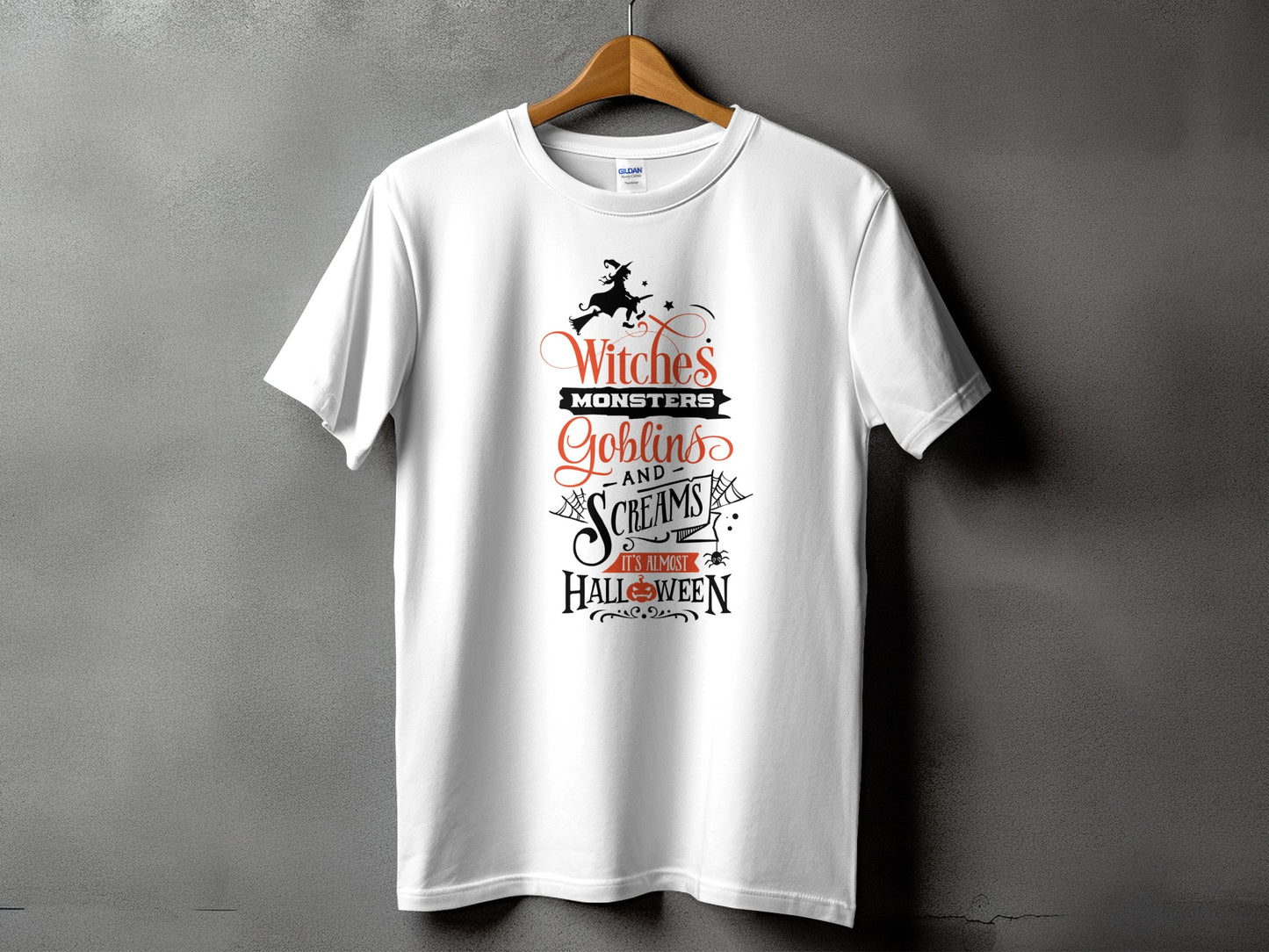White t-shirt with Halloween text: "Witches, Monsters, Goblins, Screams, It's Almost Halloween".