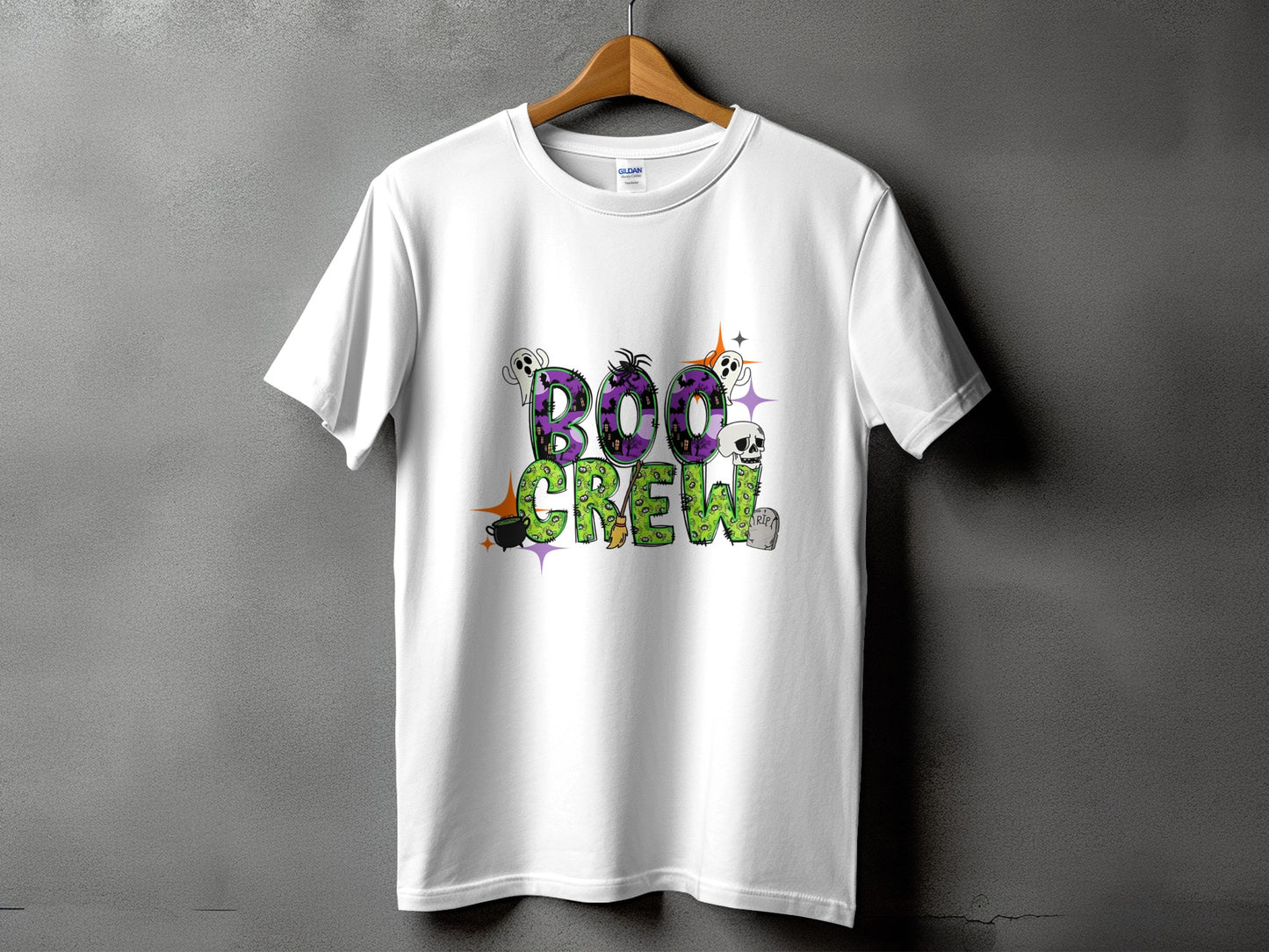White t-shirt with "Boo Crew" Halloween graphic featuring ghosts, skull, and cauldron.