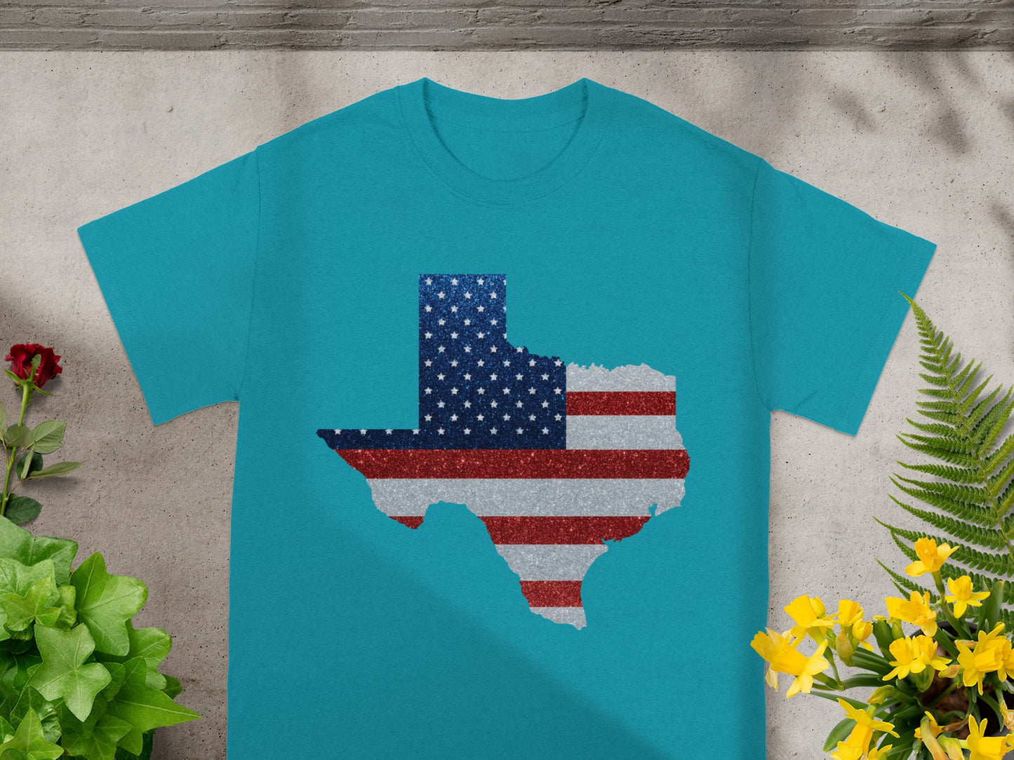 Teal t-shirt with a Texas shape outline filled with American flag glitter design.