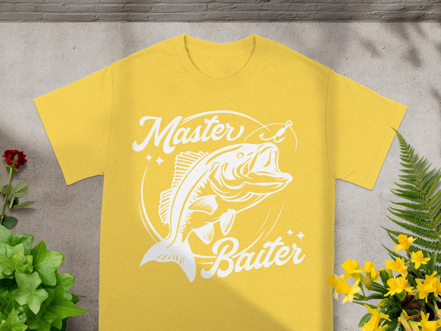 Yellow t-shirt with white graphic of a fish and text "Master Baiter".