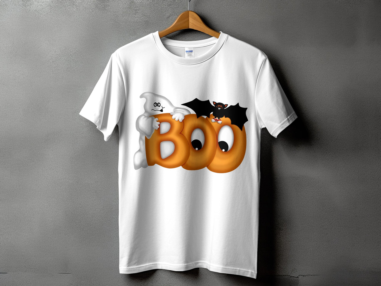 White t-shirt with "BOO" text, a cartoon ghost, and a bat for Halloween.