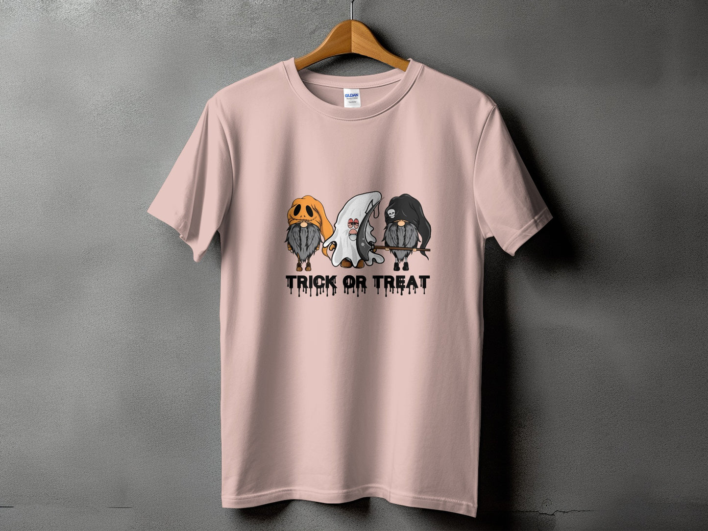 Pink t-shirt with three Halloween gnomes and "Trick or Treat" text.