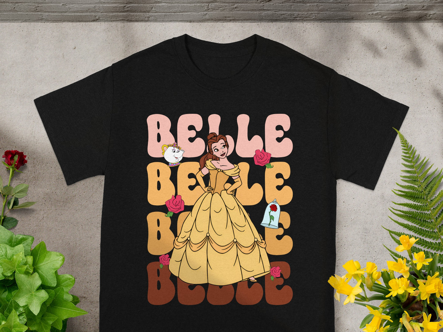 Belle in yellow dress with "Belle" text, roses, and enchanted rose.