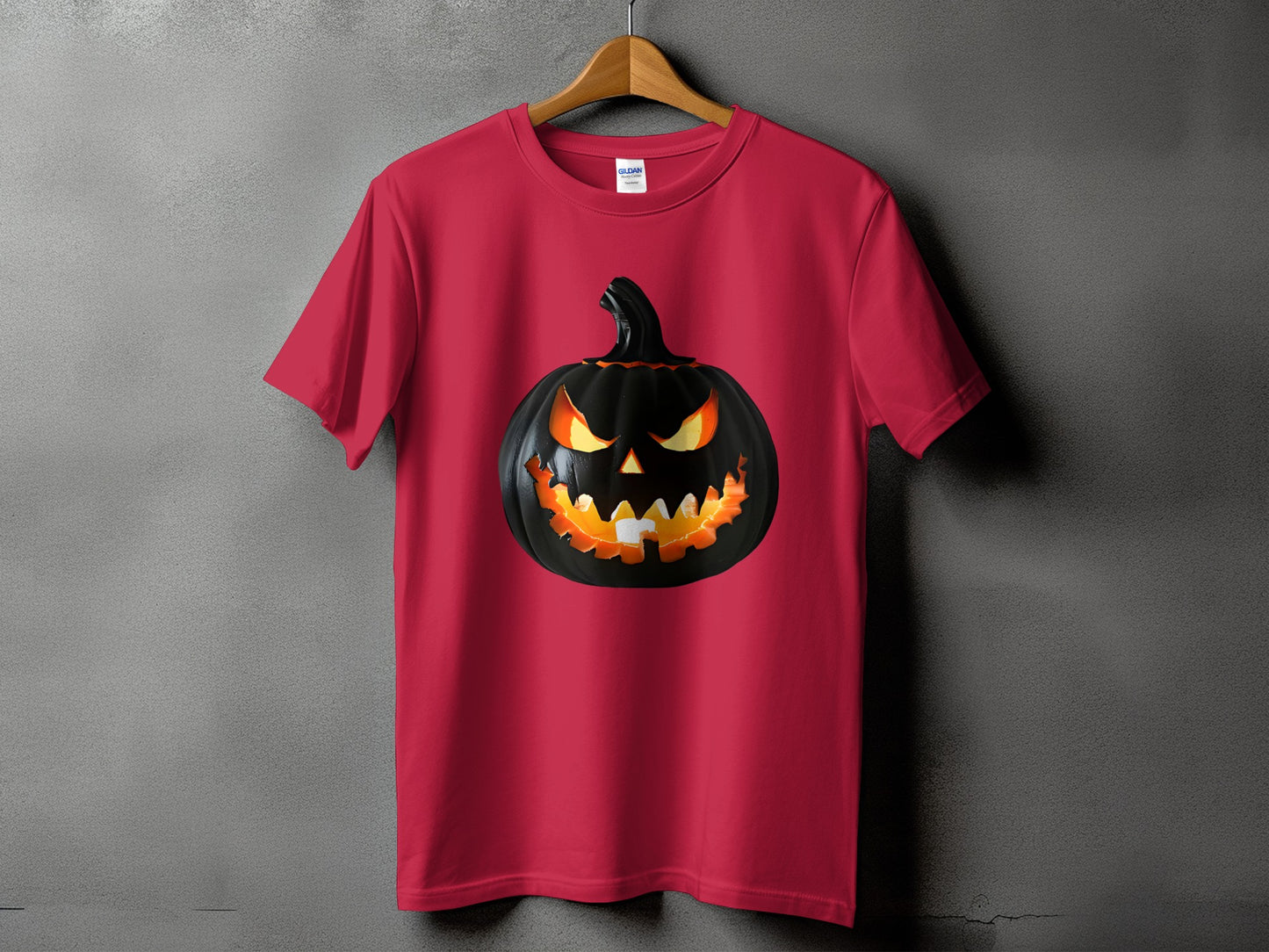 Red t-shirt featuring a black jack-o'-lantern with glowing orange eyes and teeth.