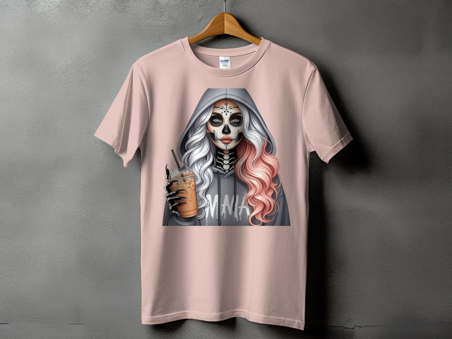 Pink t-shirt with graphic of skeleton sugar skull woman holding iced coffee.