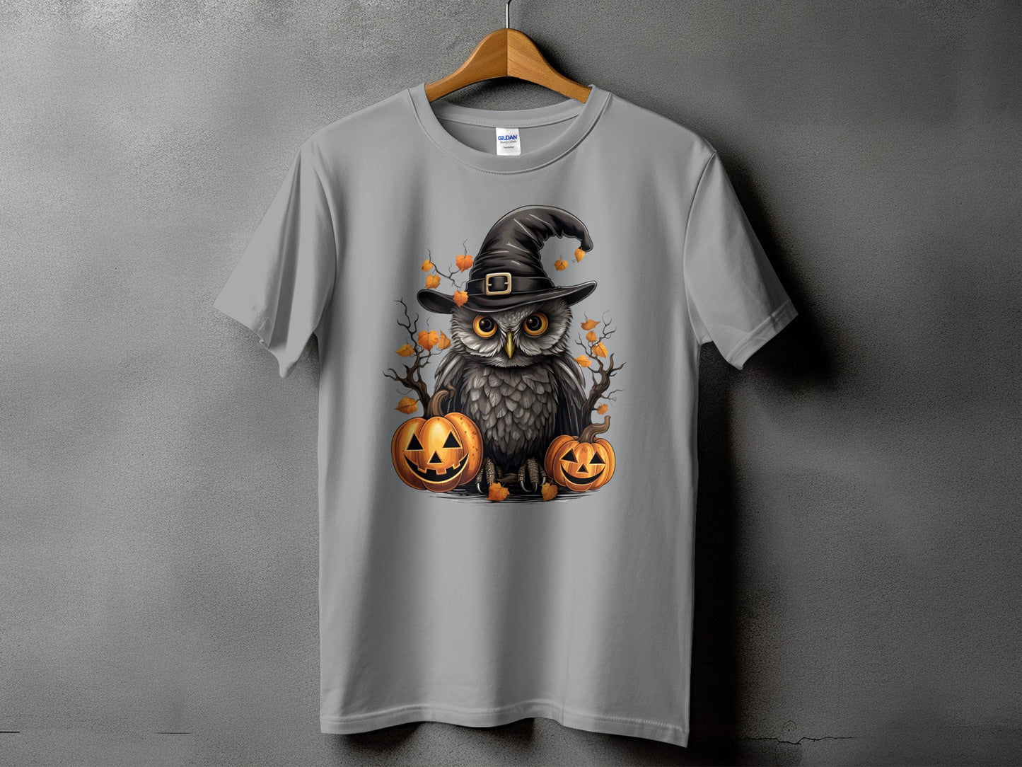 Gray t-shirt featuring a Halloween owl graphic with pumpkins and autumn leaves.