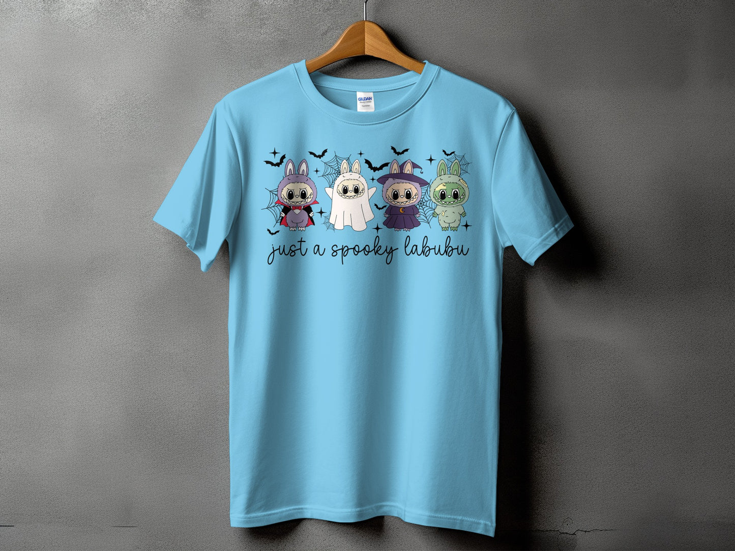 Light blue t-shirt with four spooky labubu characters and bats.