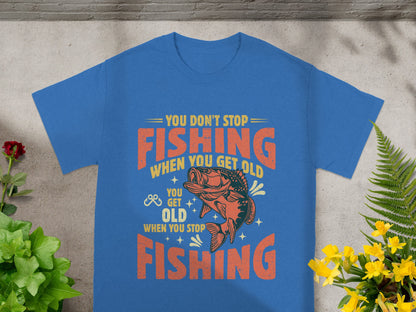 Blue t-shirt with "You Don't Stop Fishing When You Get Old" text and a fish.