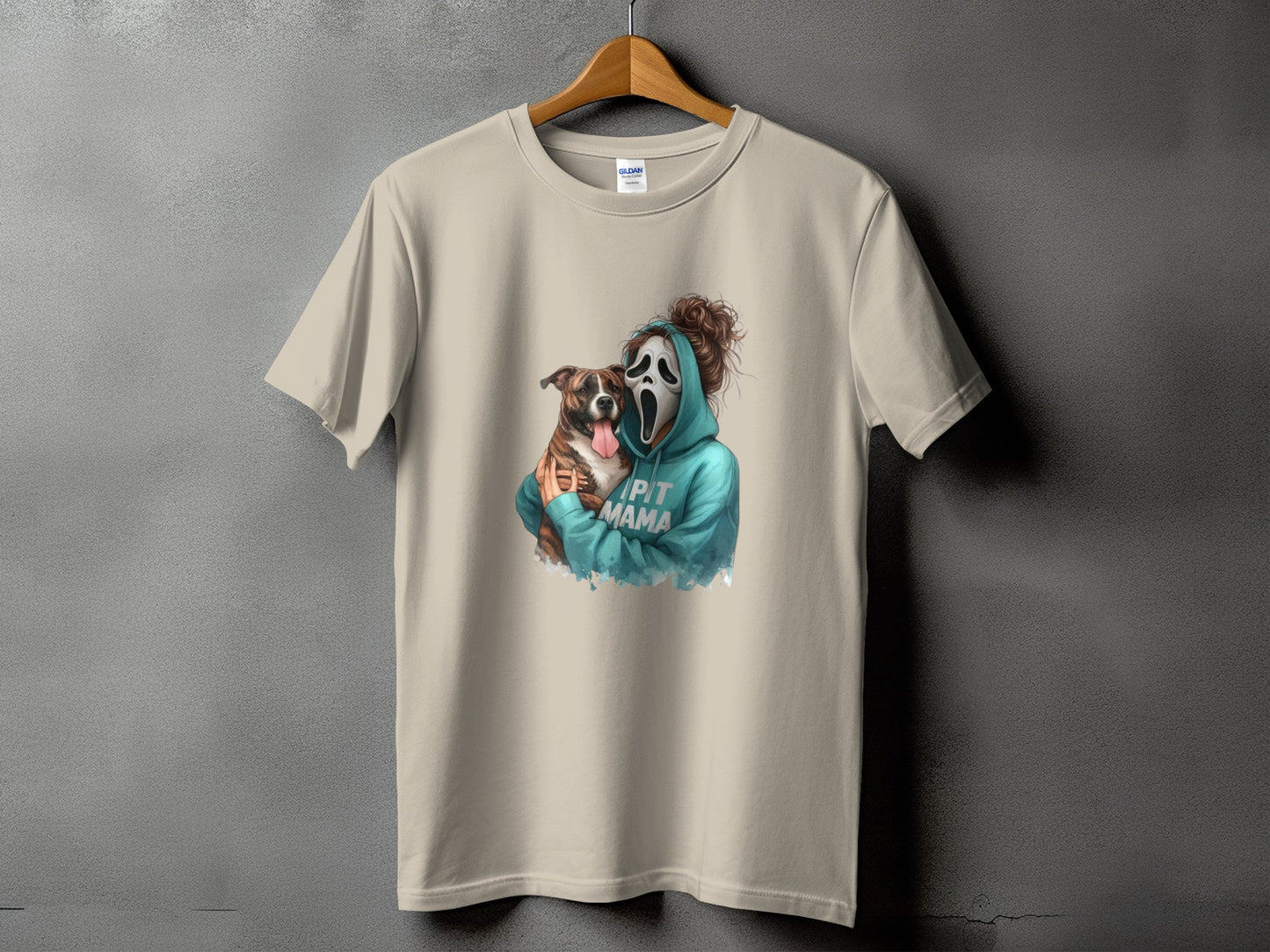 Light tan t-shirt with graphic of person in ghost mask holding dog, text reads "PIT MAMA".
