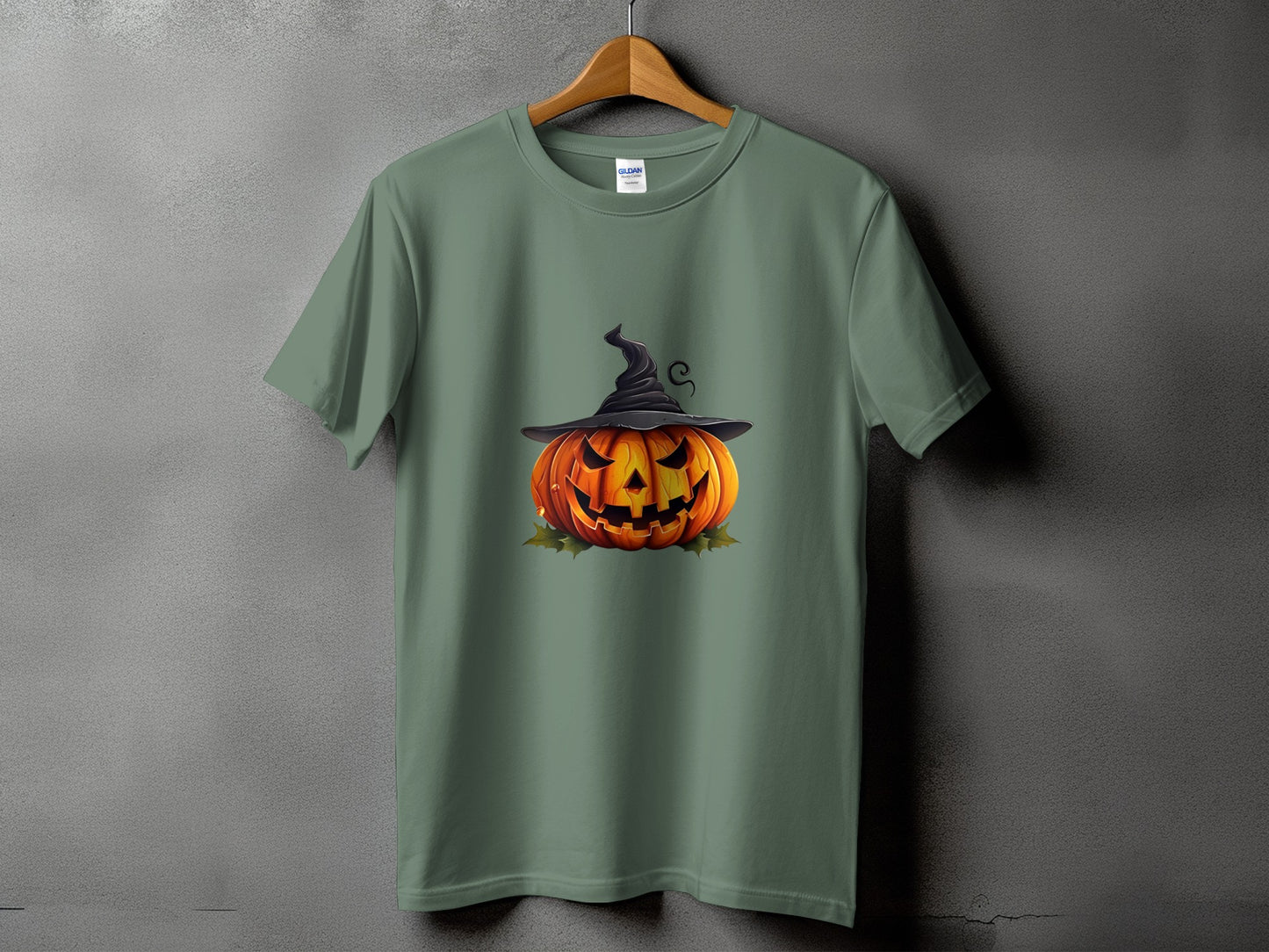 Green t-shirt with a jack-o'-lantern wearing a witch hat.