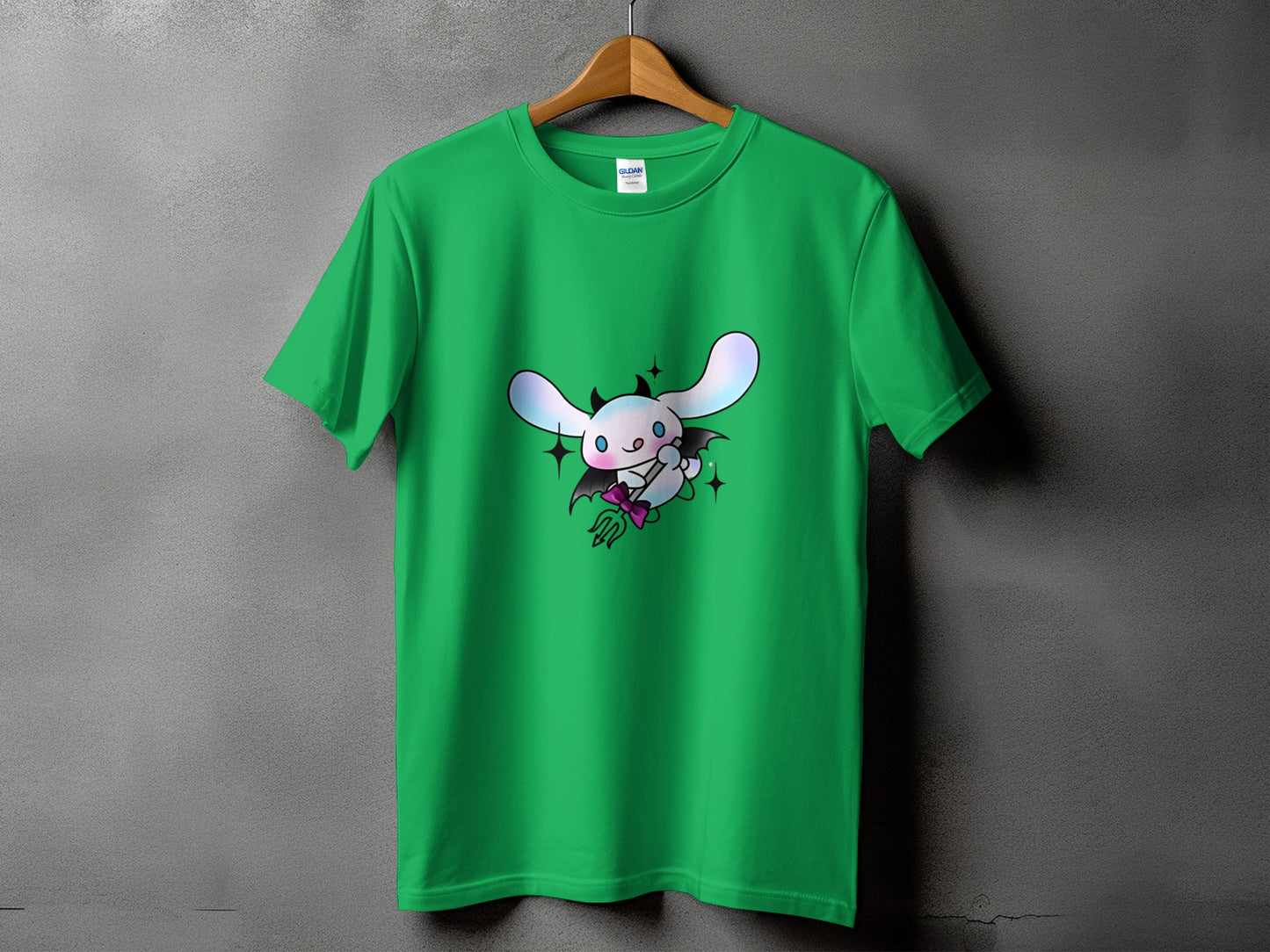 Green t-shirt with a cute devil bunny graphic and stars.