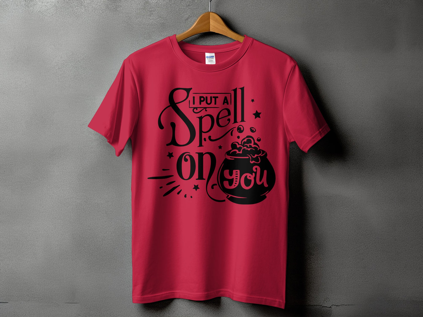 Red t-shirt with black text and graphic saying "I PUT A Spell on you".