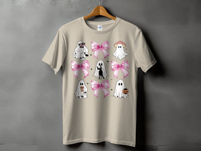 Tan t-shirt with a grid of cute ghosts, pink bows, and Halloween motifs.