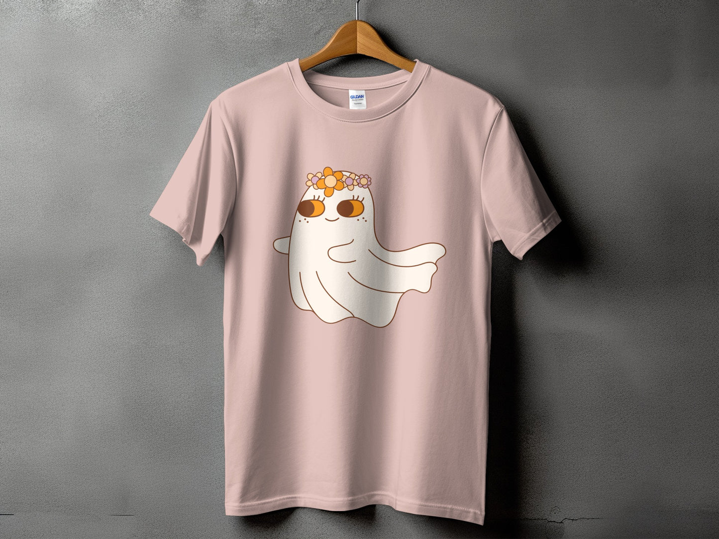 Pink t-shirt with a cute ghost wearing a floral crown graphic.