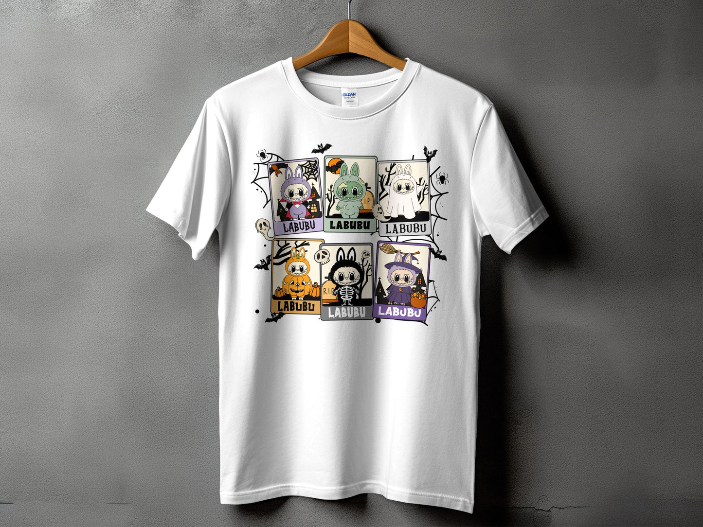 White t-shirt with a Halloween-themed graphic featuring six cartoon characters.