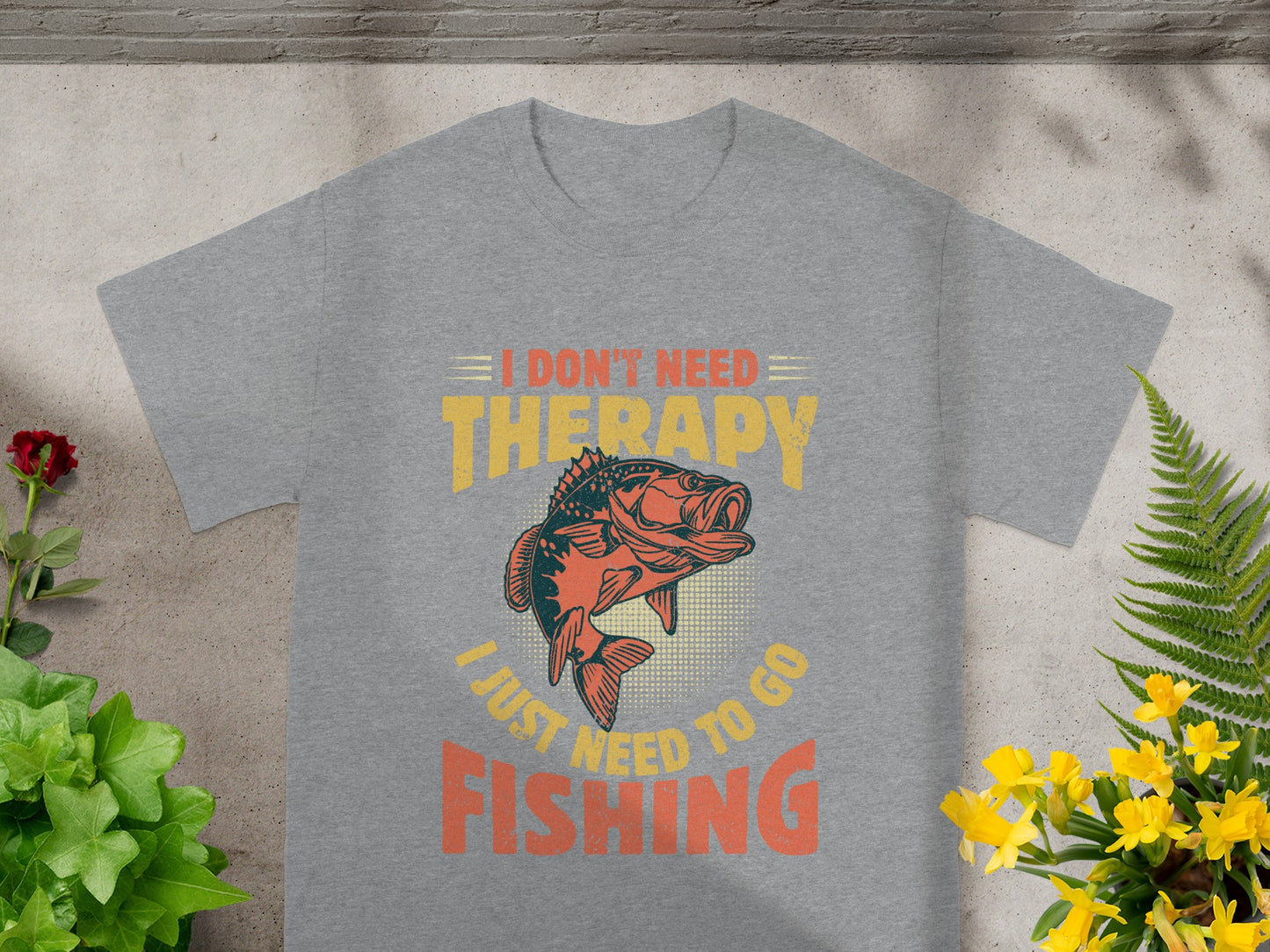 Gray t-shirt graphic: I don't need therapy, I just need to go fishing.
