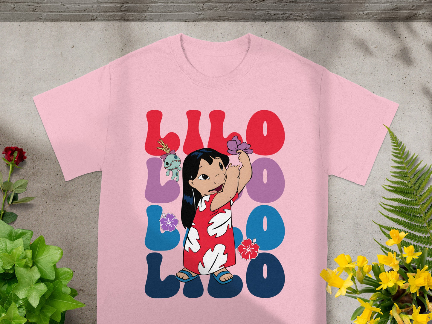 Pink t-shirt with Lilo and Stitch graphic.