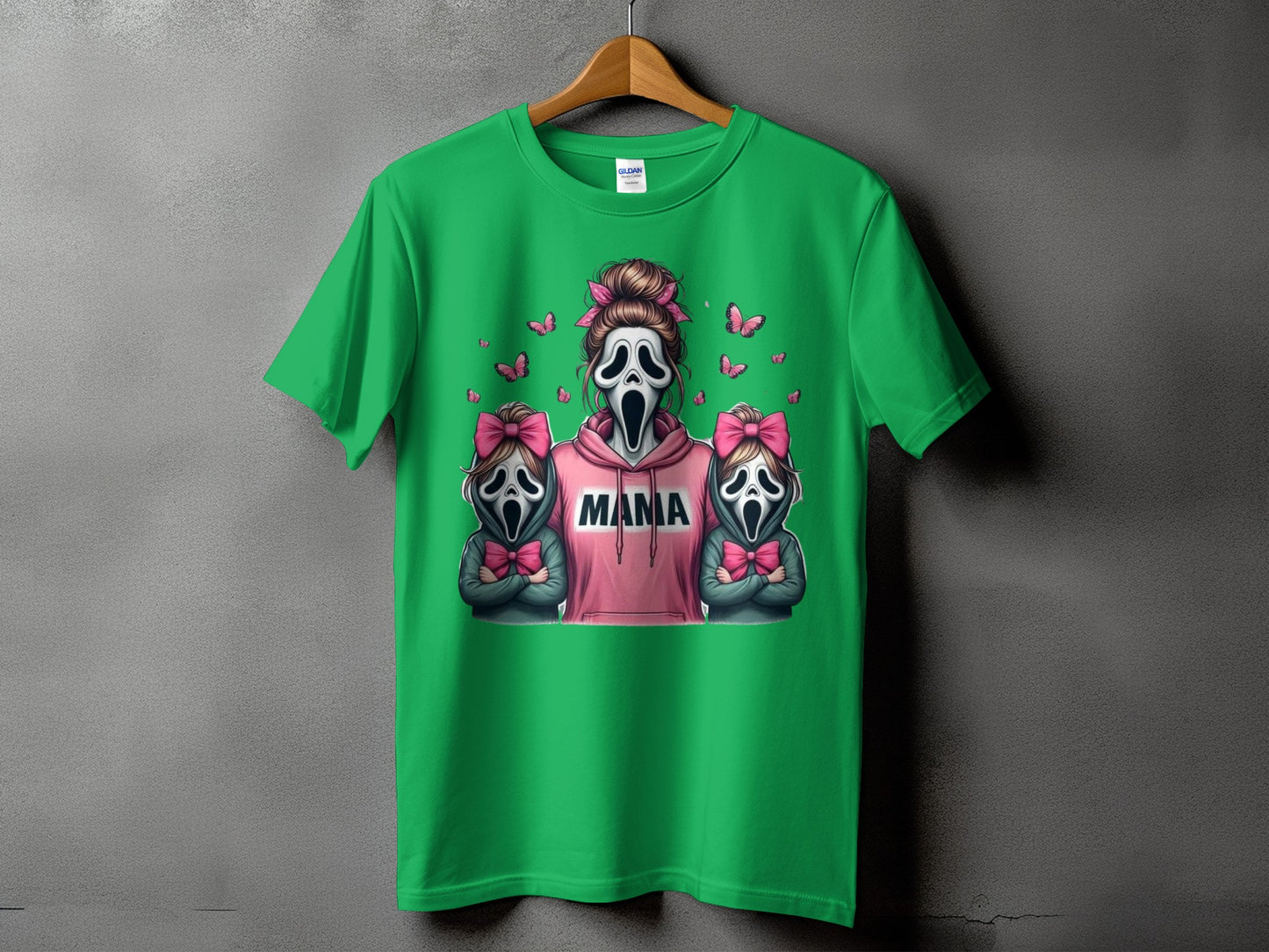 Green t-shirt with cartoon ghosts, pink bows, and "Mama" text.