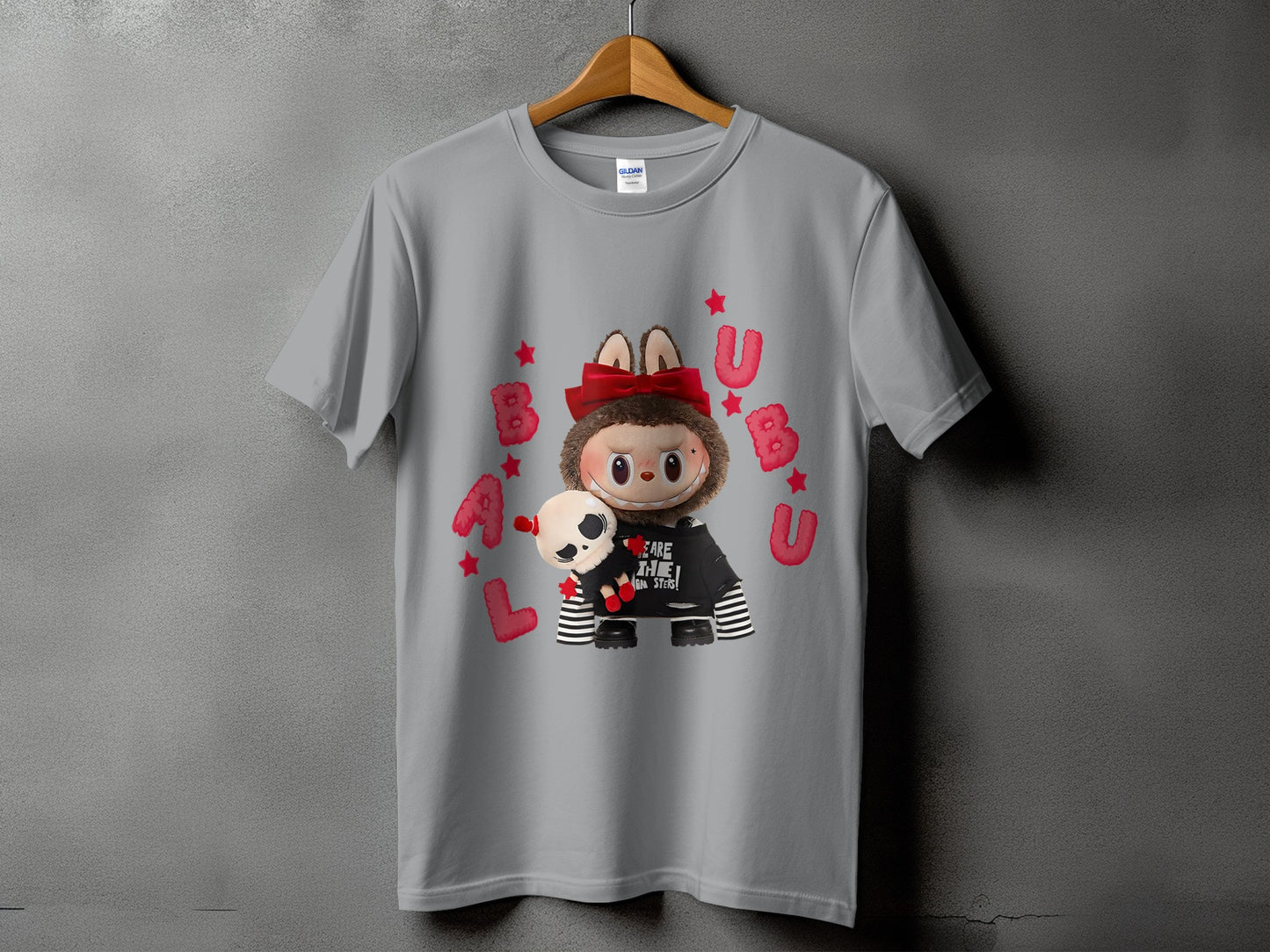 Gray t-shirt with a plush toy character and the text "WE ARE THE MONSTERS".