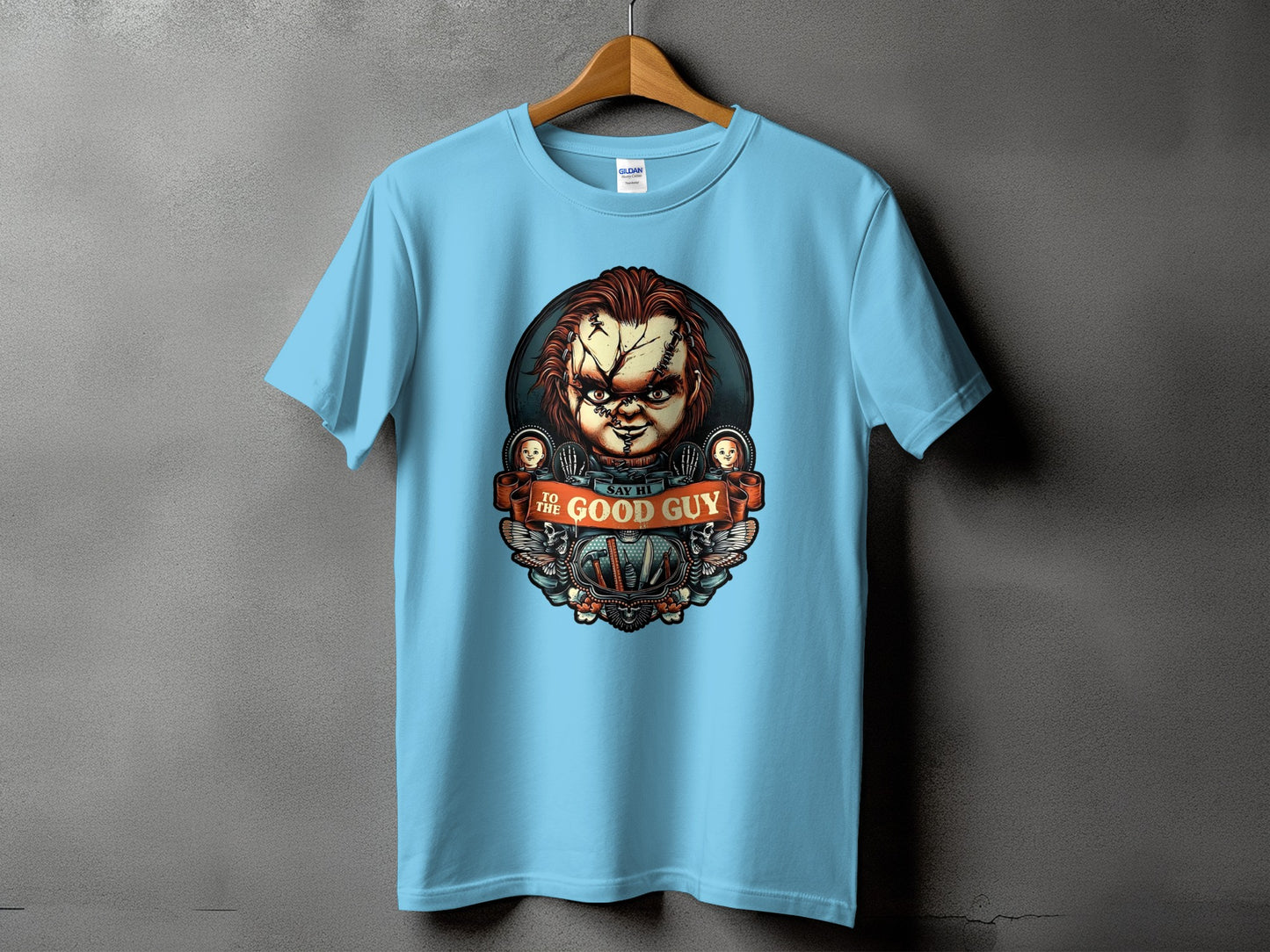 Light blue t-shirt with Chucky doll graphic saying "Say Hi to the Good Guy".