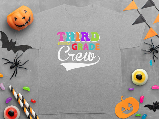 Gray t-shirt with "Third Grade Crew" text and Halloween decorations.