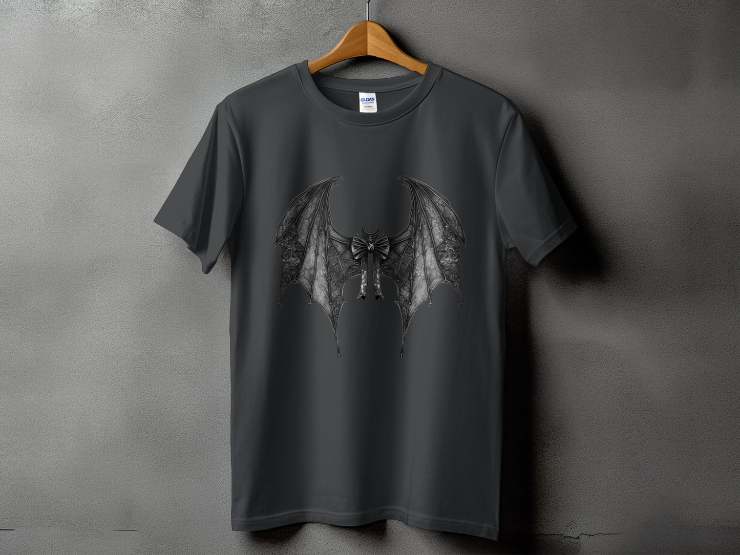 Dark grey t-shirt with gothic bat wing design and bow detail.
