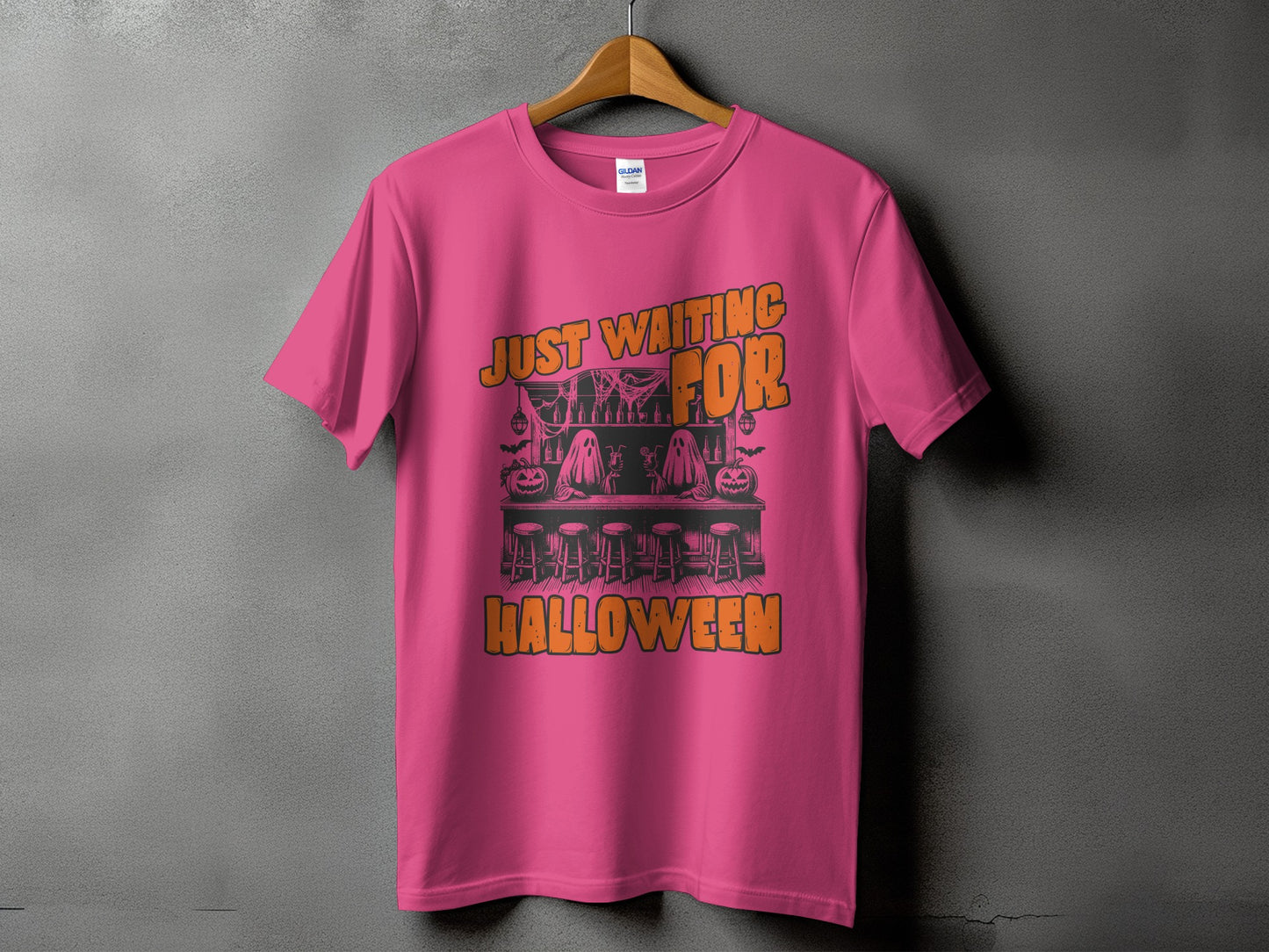 Pink t-shirt with Halloween graphic: "Just Waiting For Halloween" text.
