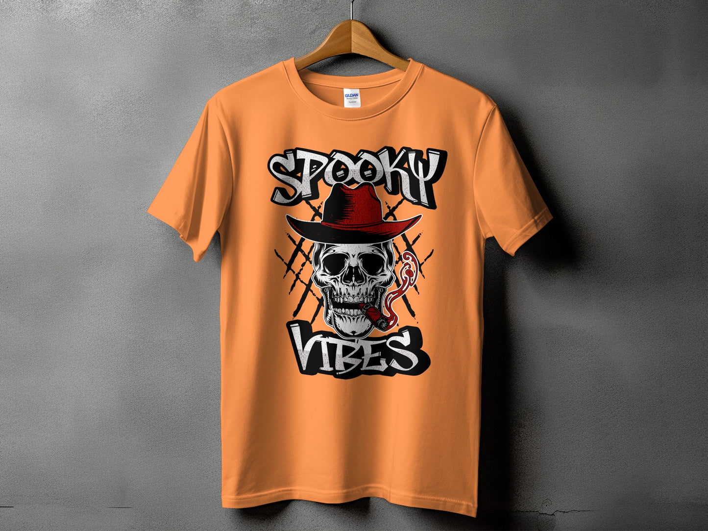 Orange t-shirt with skull wearing a hat, smoking a cigar, and "Spooky Vibes" text.