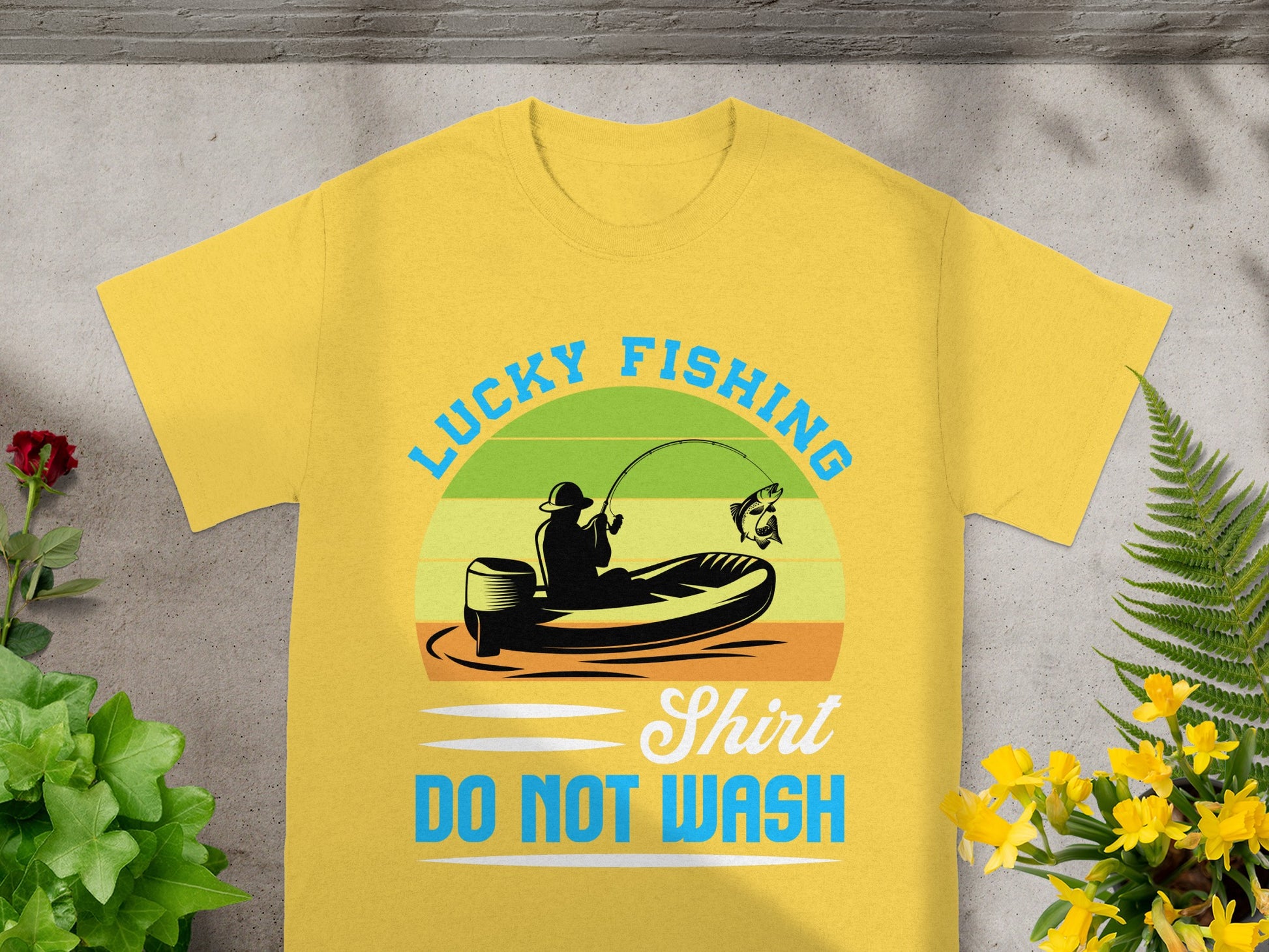 Yellow shirt with graphic of fishing, boat, and text: "Lucky Fishing Shirt DO NOT WASH".
