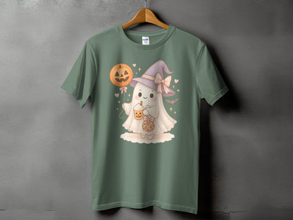 Green t-shirt with a cute ghost wearing a witch hat and holding a pumpkin balloon and drink.