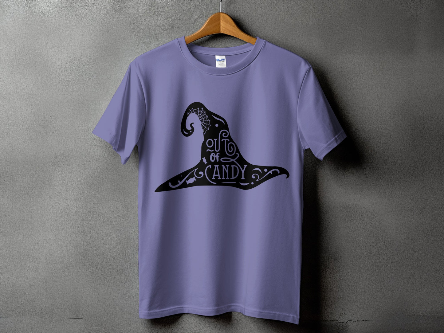 Purple t-shirt with black witch hat graphic and text that reads "out of CANDY".