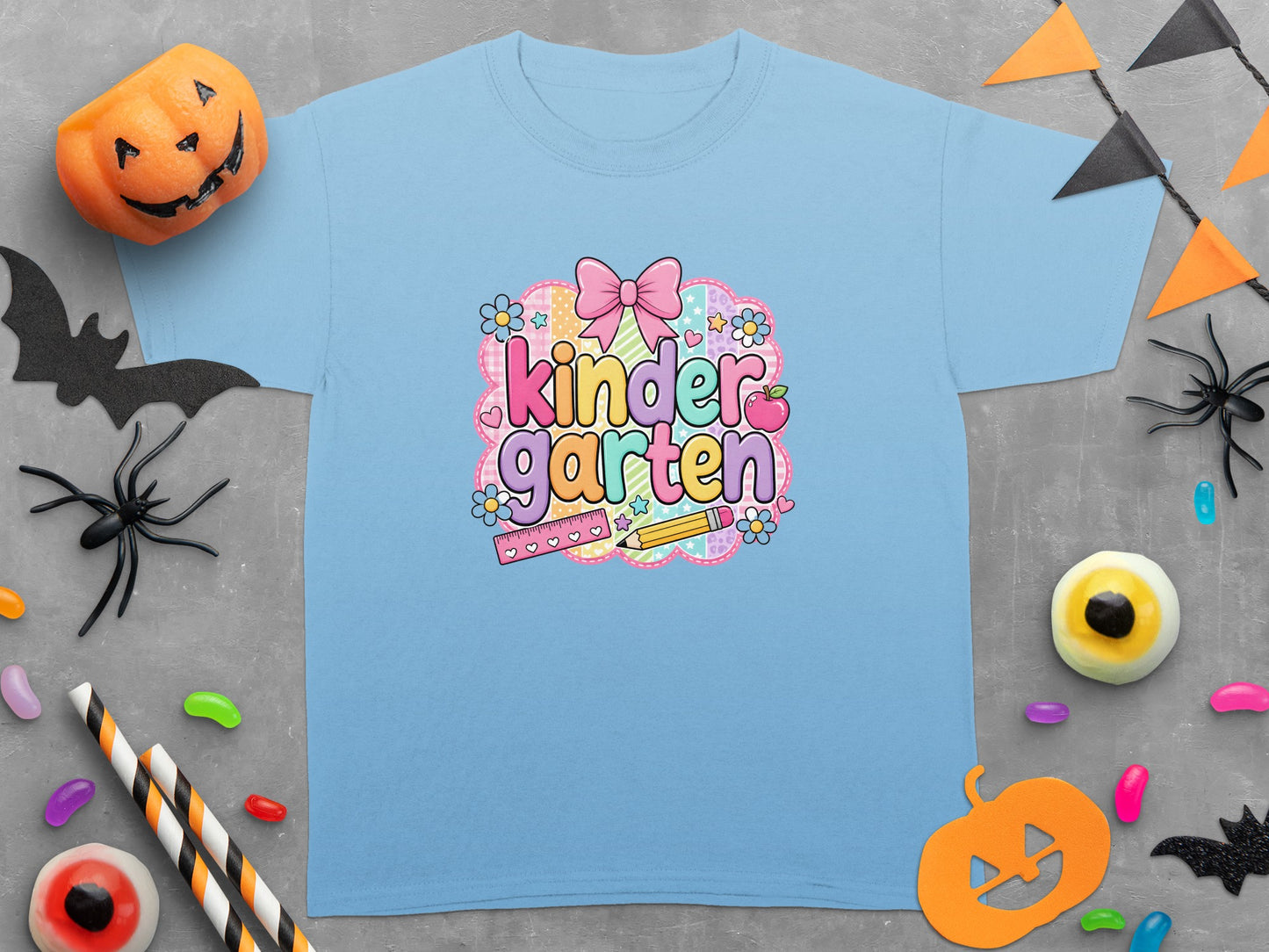 Light blue t-shirt with "Kindergarten" text, bow, and school supplies.