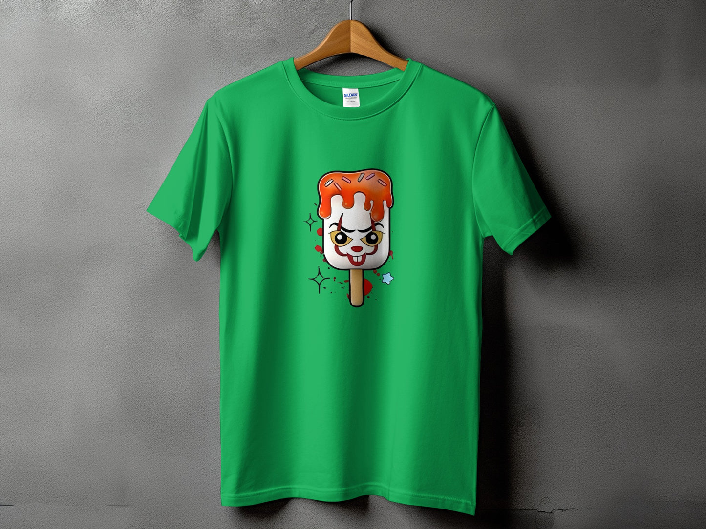Green t-shirt with clown-face popsicle graphic and stars.