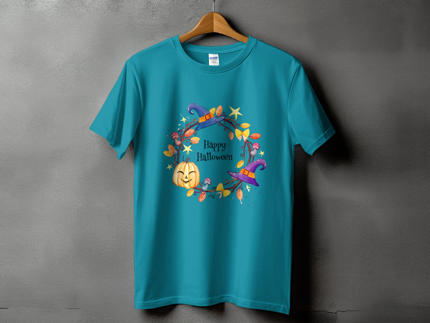 Teal t-shirt with "Happy Halloween" text and a witch hat pumpkin wreath graphic.