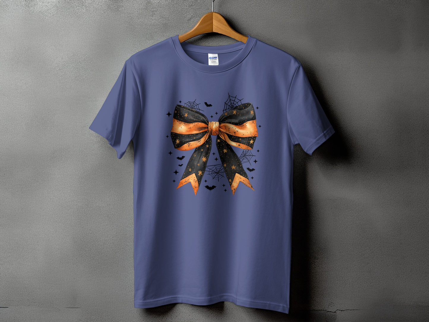 Purple t-shirt with a Halloween bow design featuring bats and spiderwebs.