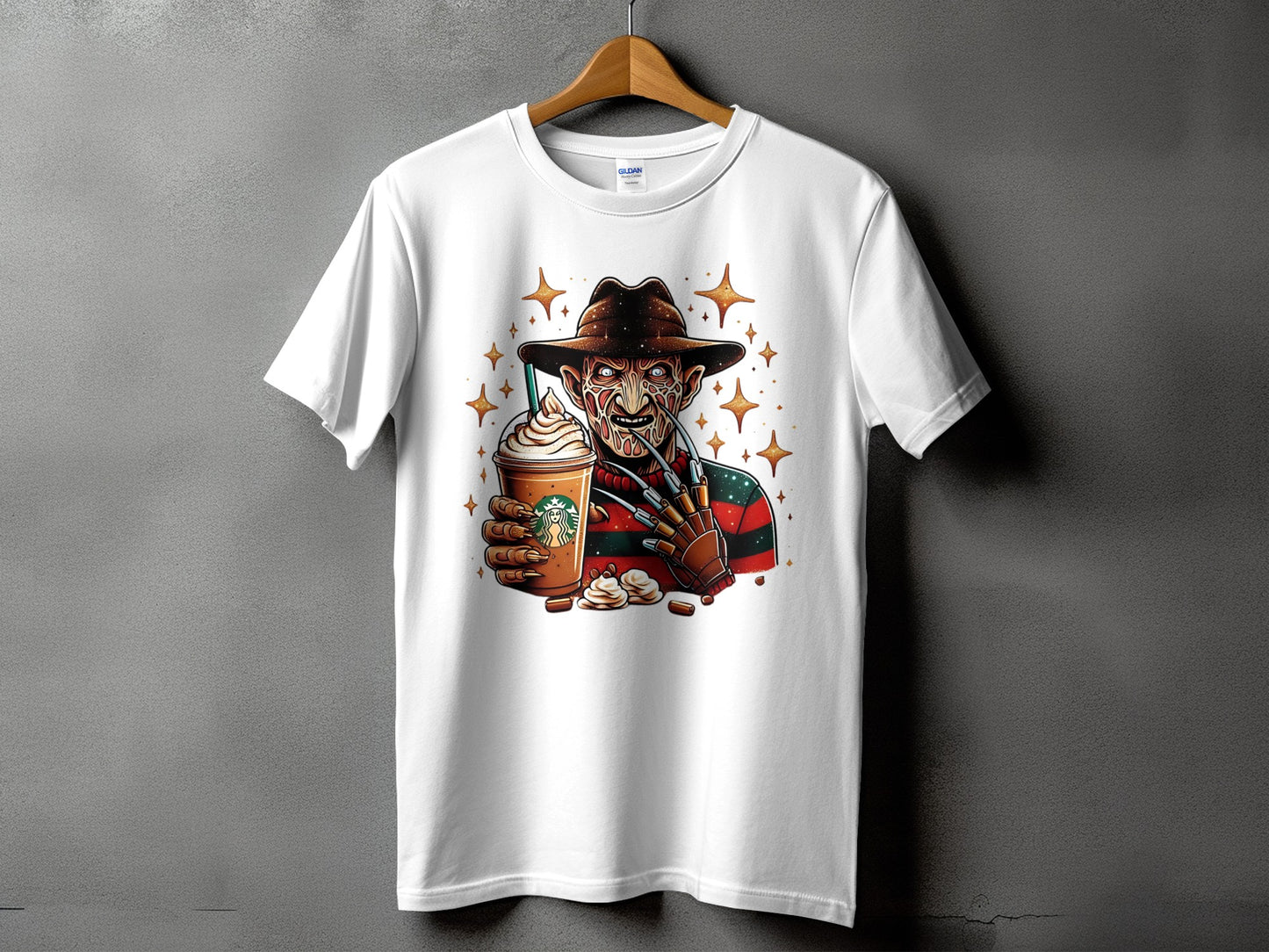 White t-shirt featuring Freddy Krueger holding a Starbucks drink with sparkly stars.