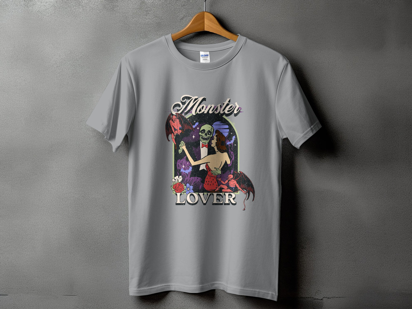Grey t-shirt with "Monster Lover" text and illustration of a skeleton, woman, and devil.