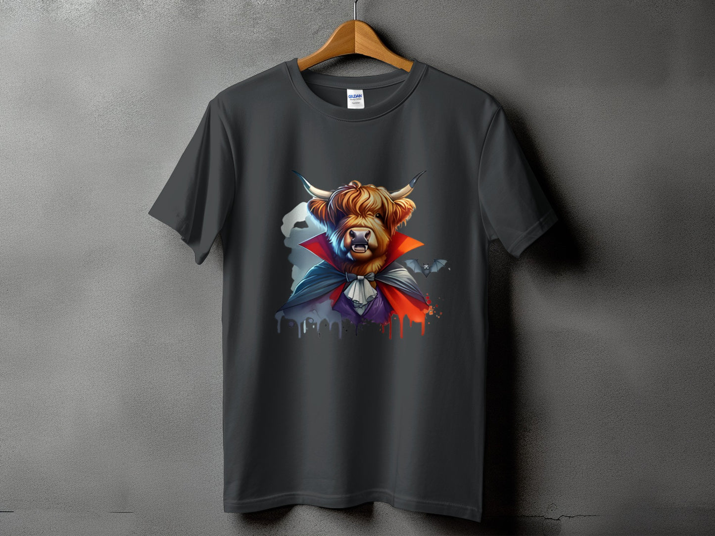 Dark grey t-shirt with a Highland cow dressed as a vampire with bats.